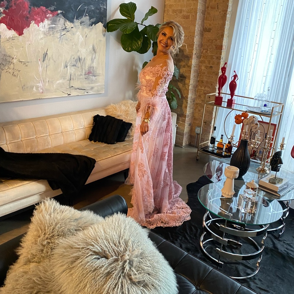 Custom feather and beaded gown made to look like Chrissy teigan gown